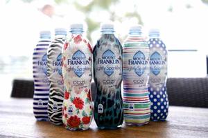 Six of Jennifer Hawkin's designs for her Cozi swimwear range are now gracing limited edition bottles of Mt Franklin Lightly Sparkling water over summer.